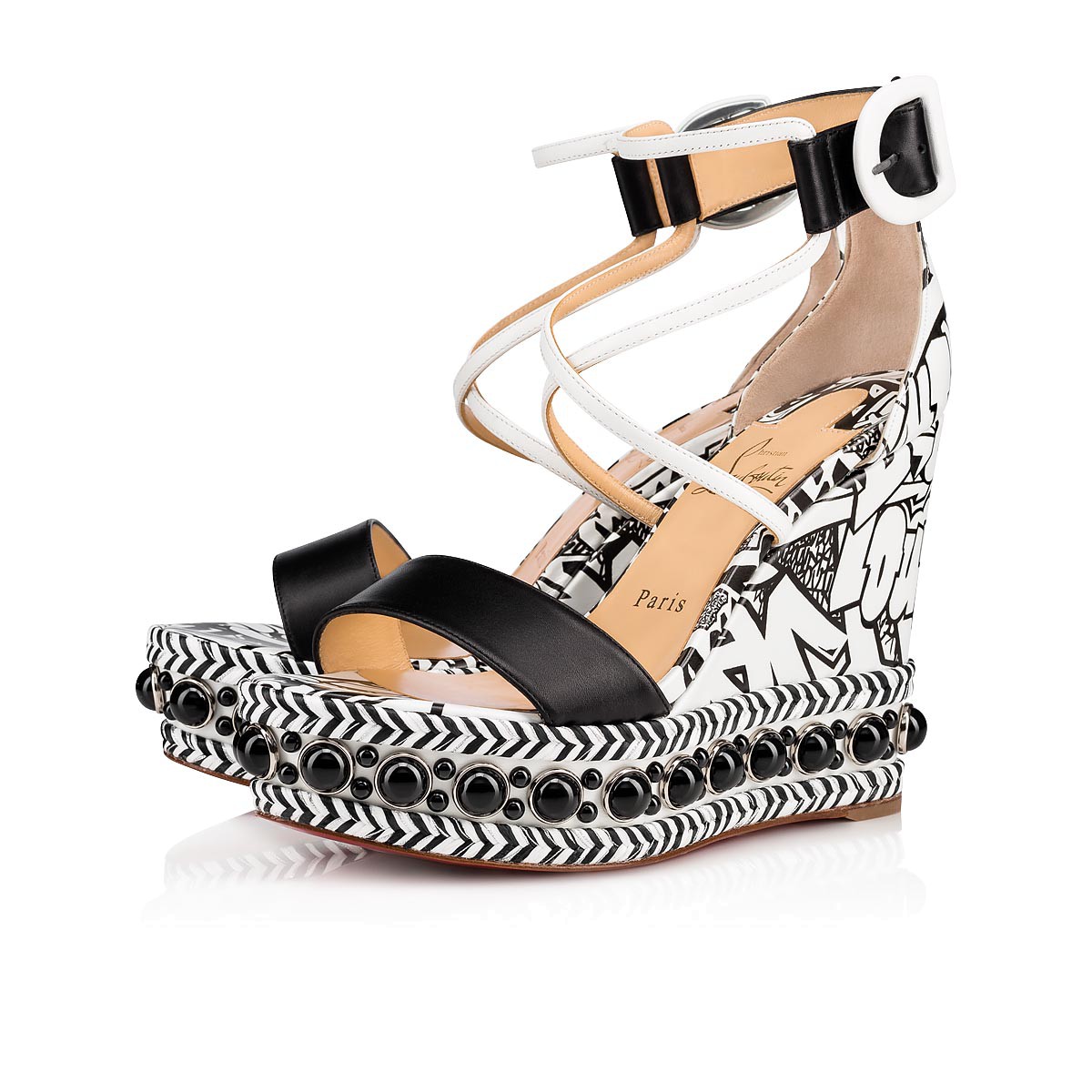Sandali bianchi e neri con zeppa fumetto Christian Louboutin a 695 euro